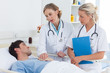 Doctors talking to a patient