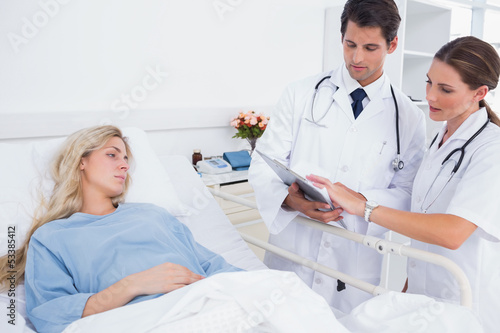 Photo: Hospitalized woman and doctors Hospitalized woman and doctors
