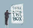 Businessman drawing think outside the box message