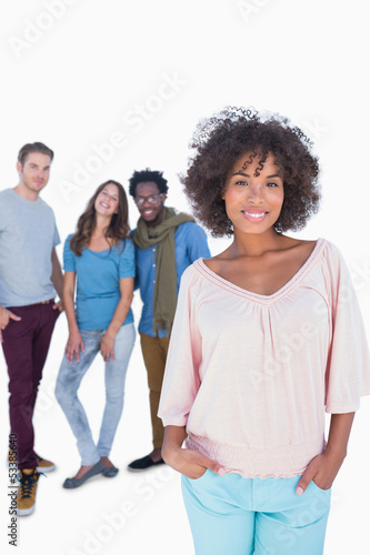 Photo: Stylish woman gesturing in front of a group of fashion people Stylish woman gesturing in front of a group of fashion people