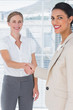 Businesswomen shaking hands