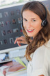 Portrait of a cheerful photo editor wearing a headset