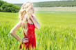 Photo: beautiful blonde girl in green field beautiful blonde girl in green field