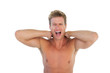 Man screaming and suffering from neck pain