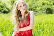 Photo: beautiful blonde girl in green field beautiful blonde girl in green field