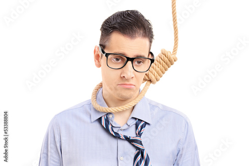 Photo: Depressed man executing a suicide with a rope Depressed man executing a suicide with a rope
