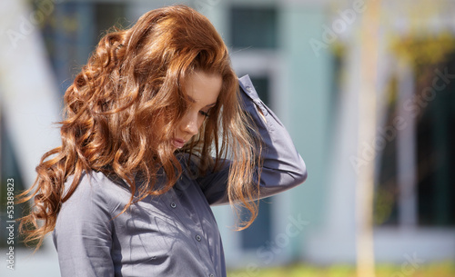 Photo: Young happy women or student on the property business background Young happy women or student on the property business background