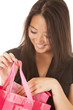 woman smile look in pink bag
