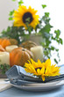Autumn table setting with candles and pumpkins