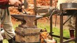 Smith makes a metal object on the historic festival