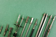 Old drawing tools on a green background