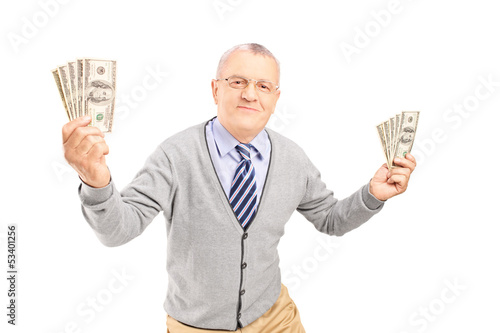 Photo: Happy senior man holding money bankontes Happy senior man holding money bankontes