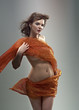 Beautiful woman in  waving fabric.