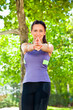 Foto: Woman exercising yoga in park Woman exercising yoga in park