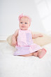 baby girl in pink dress