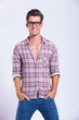 casual man stands with hands in pockets