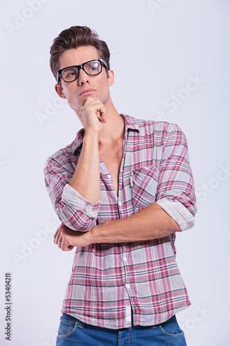 Photo: casual man thinking casual man thinking