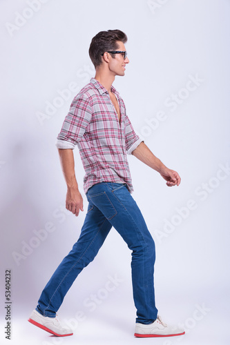 Photo: casual man walks in front of you casual man walks in front of you