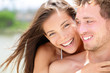 Photo: Happy romantic couple on beach in love Happy romantic couple on beach in love