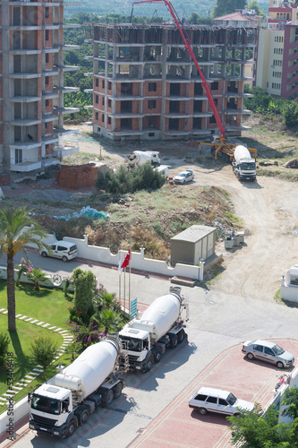Photo: Truck brought concrete for construction the building Truck brought concrete for construction the building