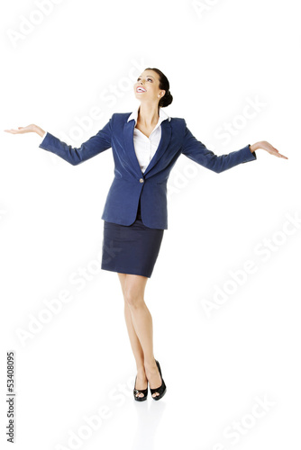 Photo: Happy young business woman showing copy space on her palm Happy young business woman showing copy space on her palm