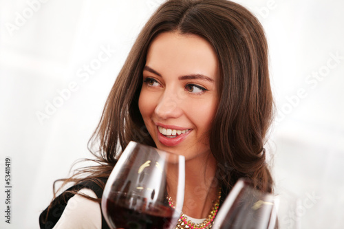 Photo: Beautiful brunette woman enjoy wine Beautiful brunette woman enjoy wine