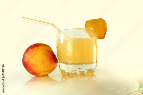 Photo: peach and peach juice in white background peach and peach juice in white background