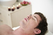 Young man relaxing in health spa