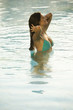 Young woman in health club swimming pool
