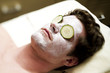 Young man getting a facial treatment