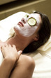 Young woman getting a facial treatment