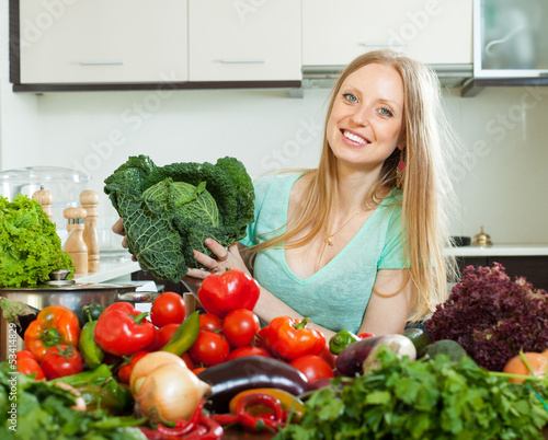 Photo: Portrait of housewife with cabbage and vegetables Portrait of housewife with cabbage and vegetables