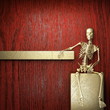 Golden skeleton on wood