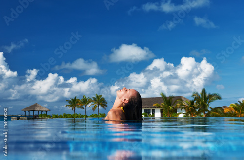 Photo: Woman at poolside Woman at poolside