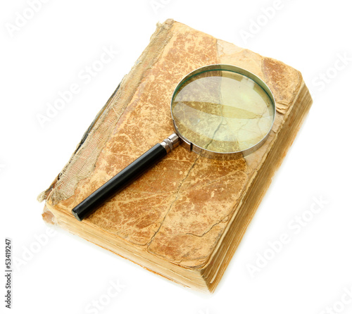Photo: Magnifying glass and book isolated on white Magnifying glass and book isolated on white