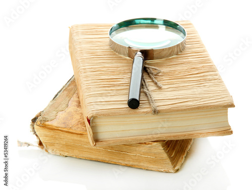 Photo: Magnifying glass and book isolated on white Magnifying glass and book isolated on white