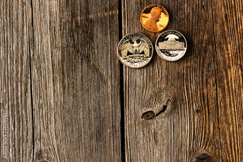 Photo: US cent coins over wooden background US cent coins over wooden background