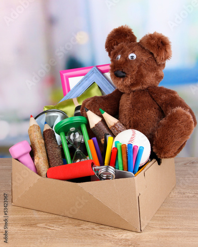 Photo: Personal property in carton on table in room Personal property in carton on table in room