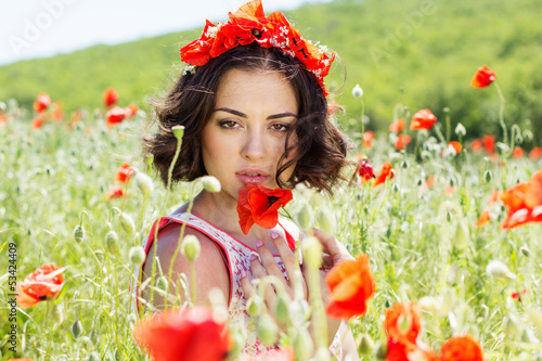 Photo: Young girl in poppies field Young girl in poppies field