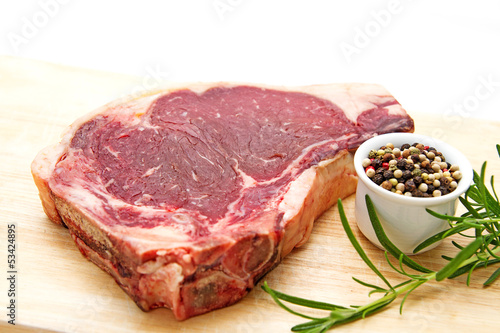 Photo: Raw dry aged t-bone steak Raw dry aged t-bone steak