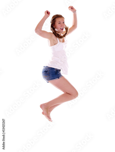 Photo: Junges Mädchen mit Zopf springt Junges Mädchen mit Zopf springt