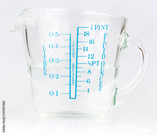Photo: Measuring cup containing water Measuring cup containing water