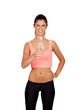Attractive brunette girl drinking water during training