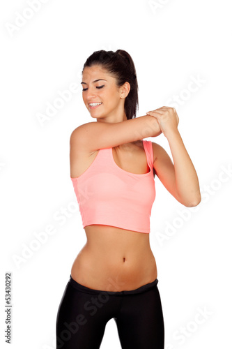 Photo: Attractive brunette girl stretching arms after the training Attractive brunette girl stretching arms after the training