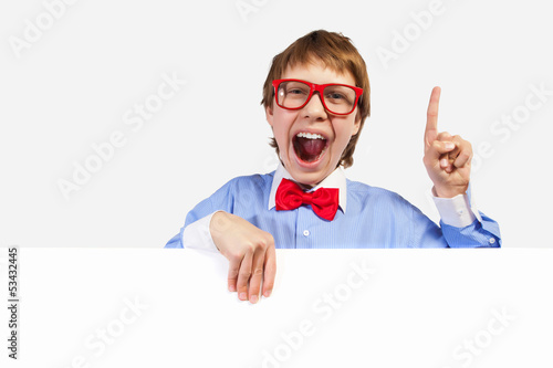 Photo: Boy in red glasses holding white square Boy in red glasses holding white square