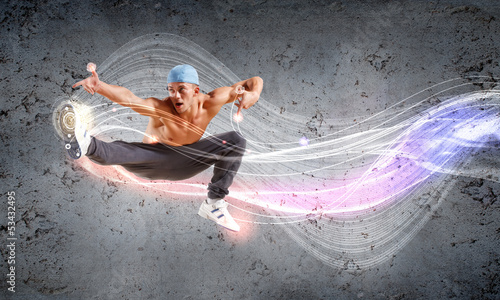 Photo: young man dancing hip hop with color lines young man dancing hip hop with color lines