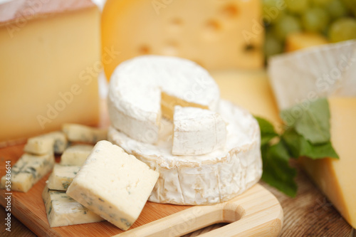 Photo: cheese on a wooden table cheese on a wooden table