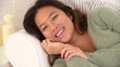 Portrait of Asian woman lying on sofa