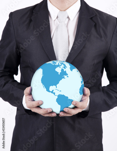 Photo: Close-up businessman hold world globe Close-up businessman hold world globe