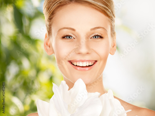 Photo: lovely woman with lily flower lovely woman with lily flower